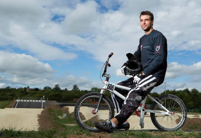 Rob Reid relaxes on his BMX